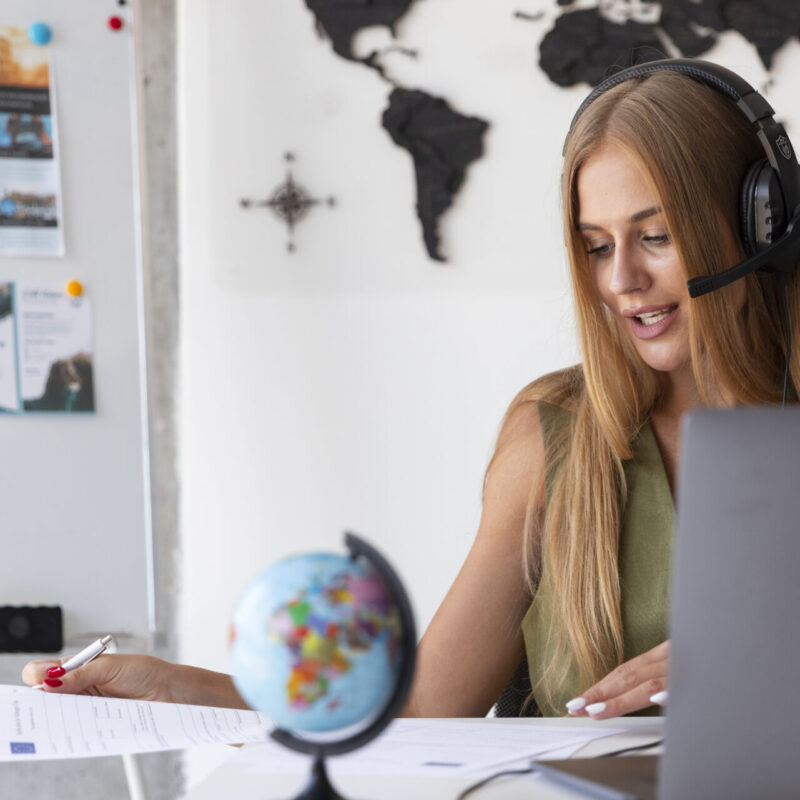 A woman making an international call to an 0800 Number
