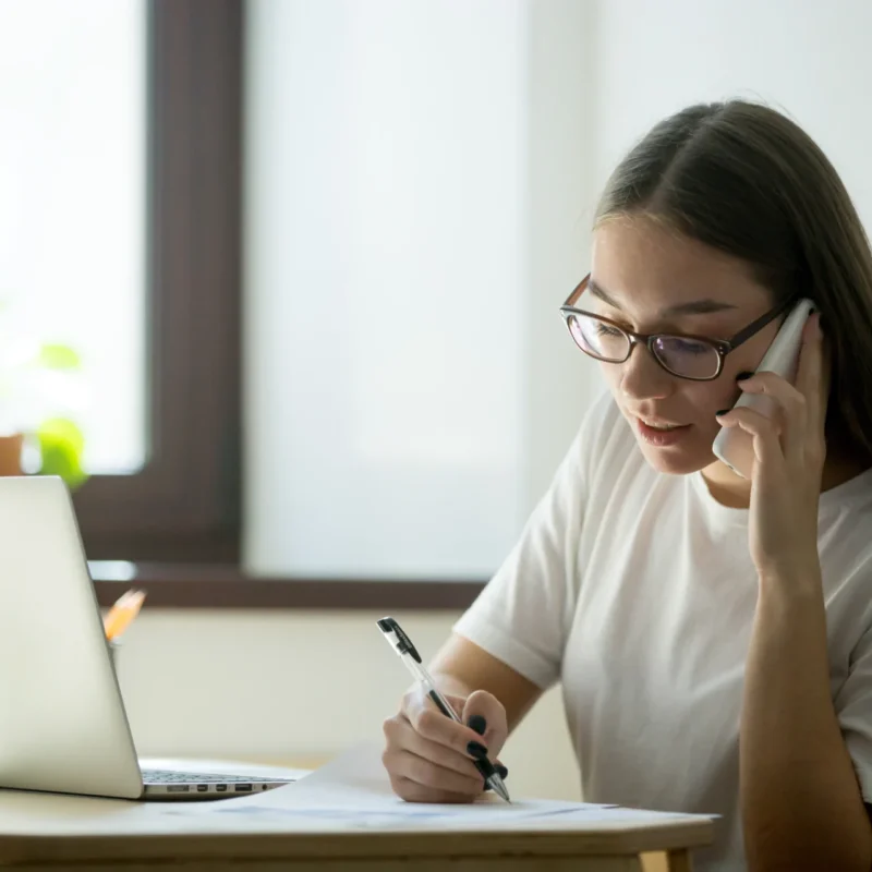 female worker consulting client phone